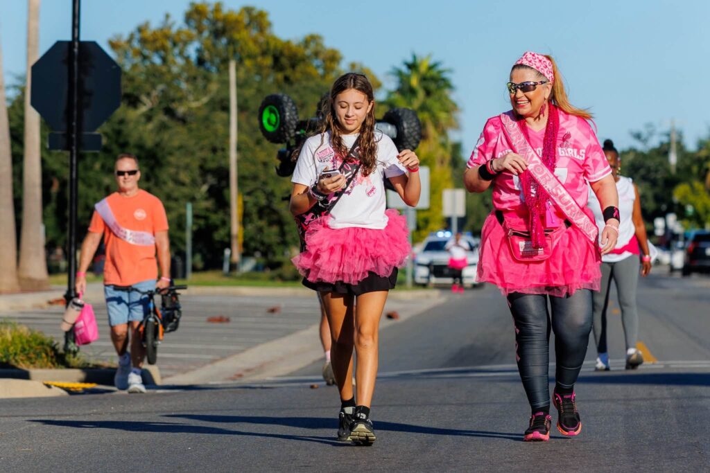 Walkers in pink tutus and sashes in downtown Gulfport